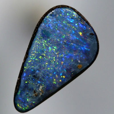 SOLID BOULDER OPAL Bright sparkles of red and gold over blue
